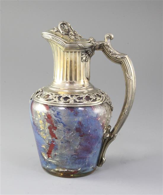 A French 950 standard silver gilt mounted coloured crackle glass claret jug, 22cm.